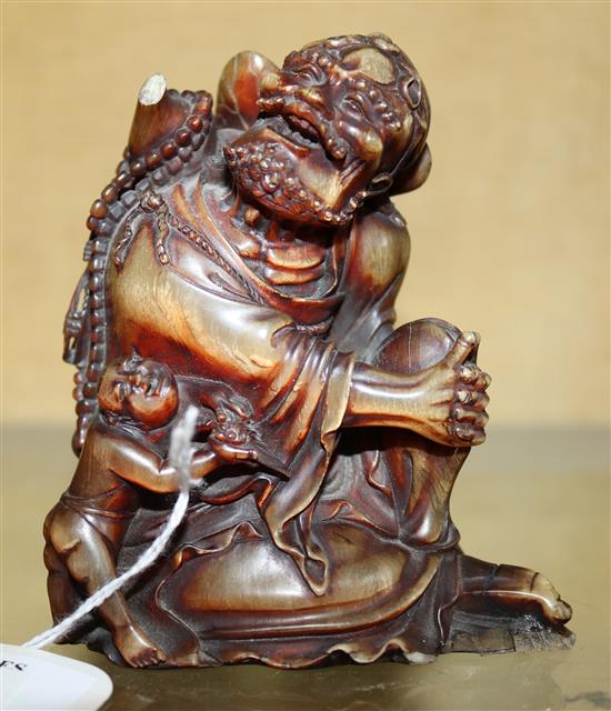 A Chinese horn group of Li Tieguai and an attendant, late 19th/early 20th century, height 10cm, slight losses